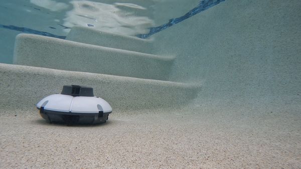 Aiper Seagull 600 Robotic Pool Cleaner running into stairs