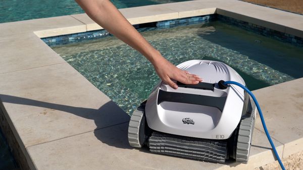 Closing the top lid of the Dolphin E10 pool cleaner