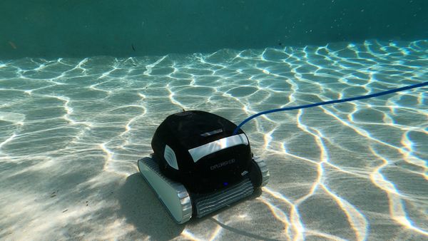 Dolphin Explorer E30 Robotic Pool Cleaner vacuuming the pool