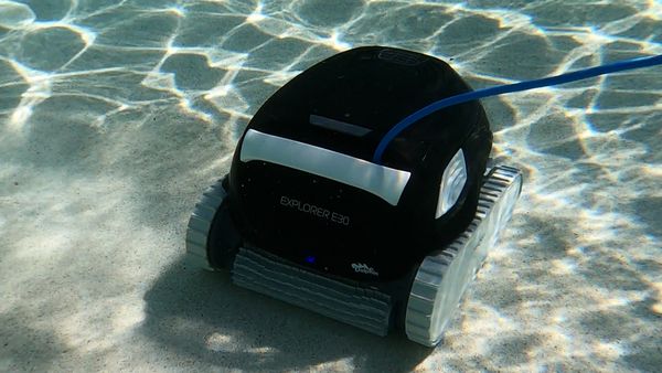 Dolphin E30 working along the side wall of the pool