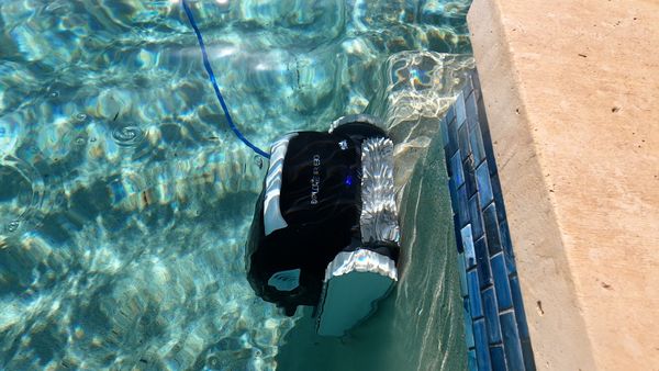Dolphin E30 climbing the pool wall during a cleaning cycle