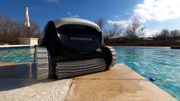 Dolphin Explorer E30 sitting poolside before a cleaning cycle