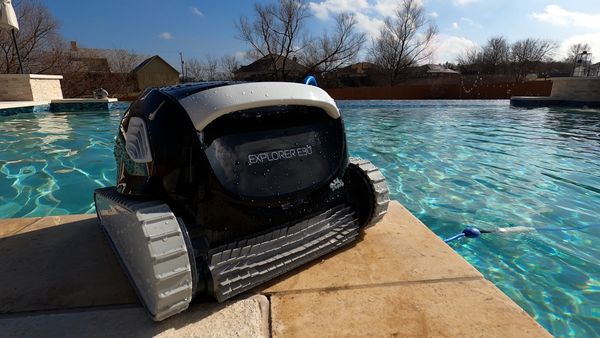 Dolphin E30 sitting poolside ready for a cleaning cycle