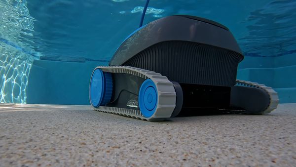 Dolphin Escape scrubbing the pool floor