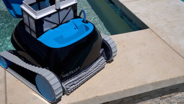 Lifting the filter basket out of the Dolphin Nautilus CC
