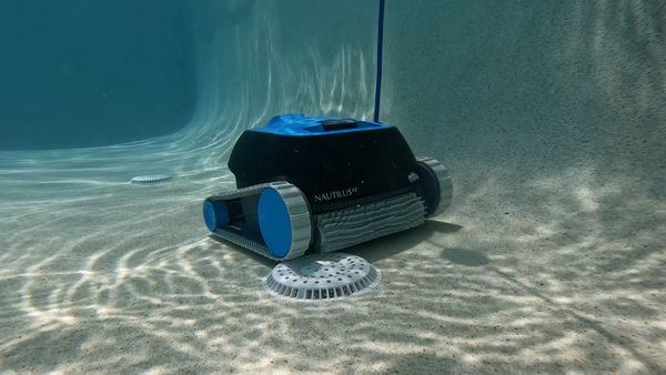 Dolphin Nautilus CC near a pool drain
