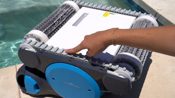 Hand touching the tracks of the Dolphin Premier