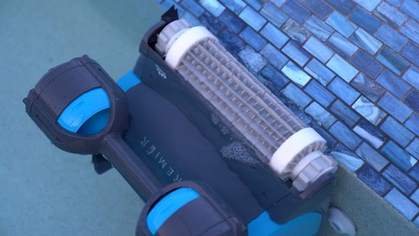 Dolphin Premier cleaning along blue waterline tile