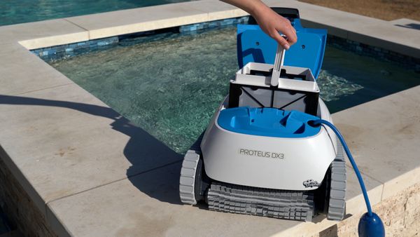 Inserting the filter basket into the Dolphin Proteus DX3