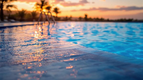 Closeup of a swimming pool during the sunset