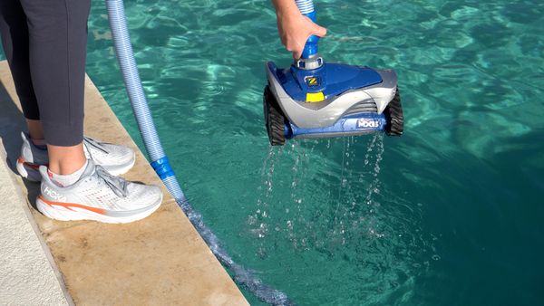 Zodiac MX6 Suction-Side Cleaner lifting out of pool